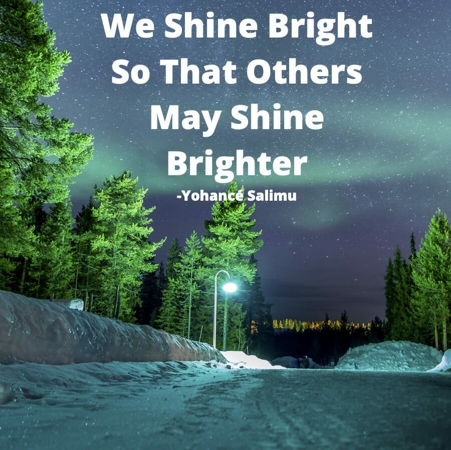 positive quote about shining bright for others with beautiful natural aurora borealis night sky in winter night.